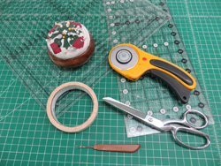 Basic Sewing Supplies -Seam ripper, masking tape, thread, scissors, pins, tape measure and so on.